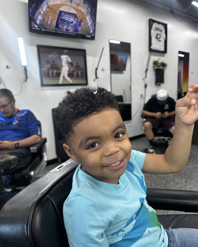 A toddler's first cut in the chair