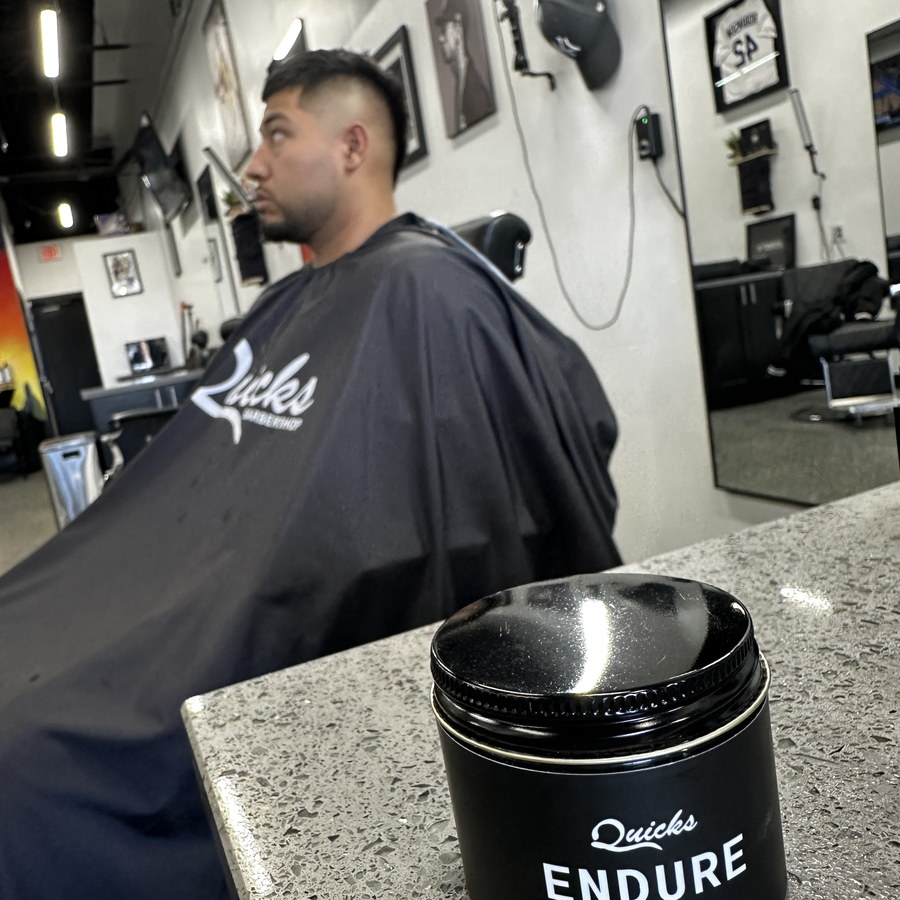 The Endure jar on the counter at Quicks Barbershop