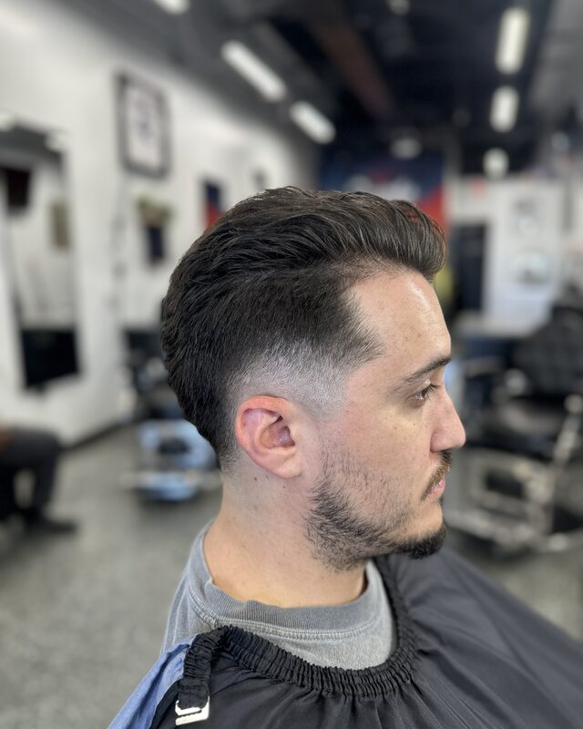 A pompadour with a faded back and sides